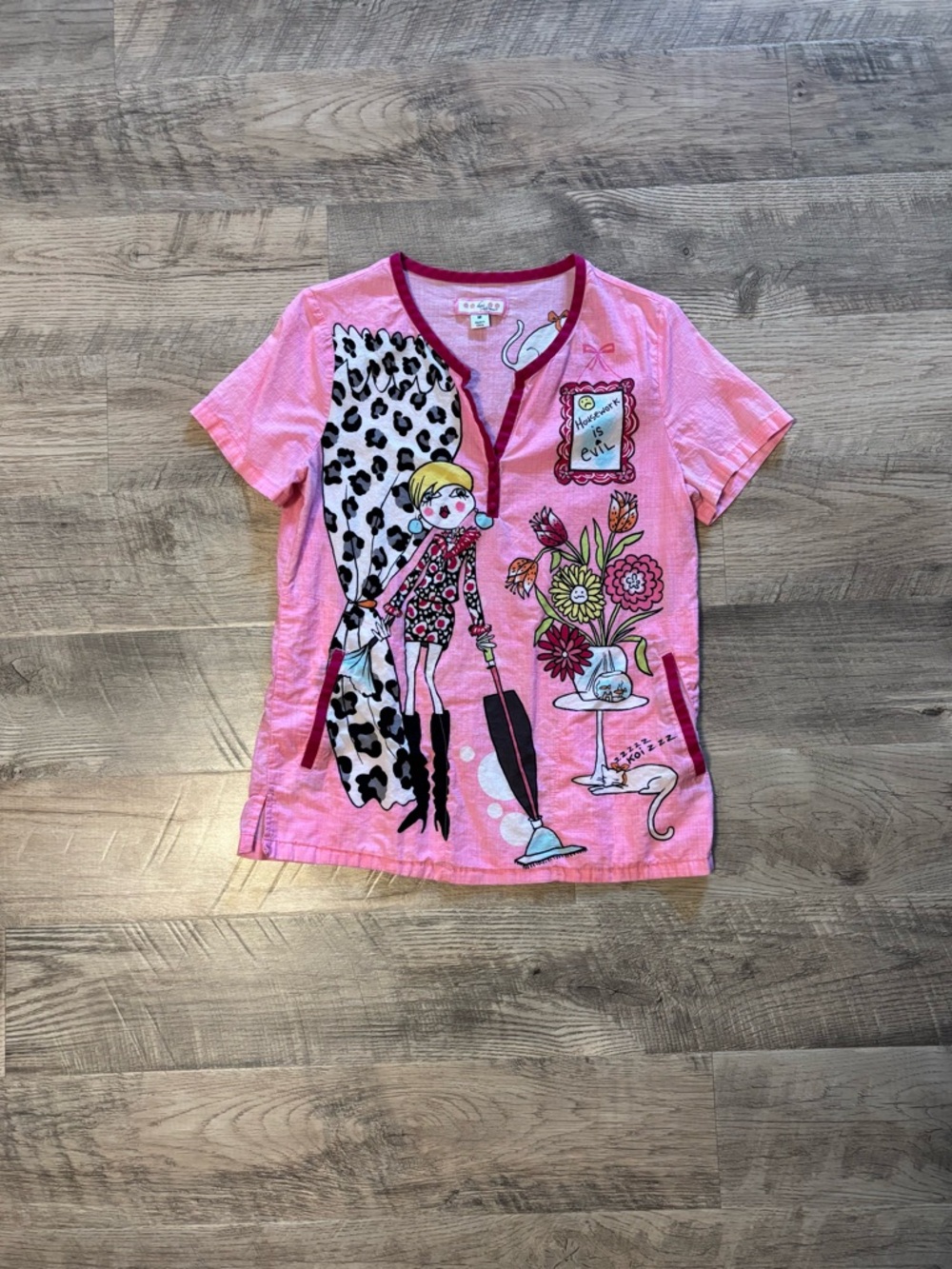 koi Bridgette scrub top: Pink Graphic Tee with Doll, Floral & Leopard Accents